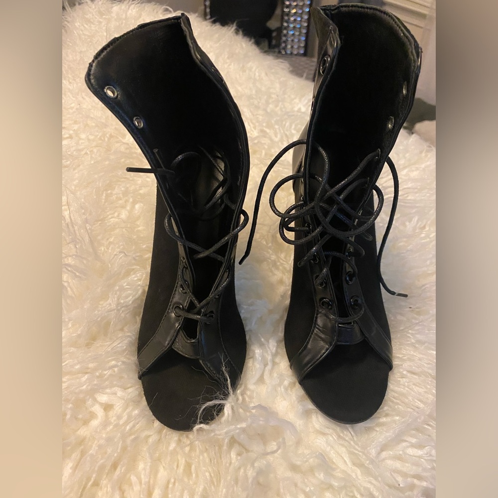 Brand new black lace up booties. Never been worn.